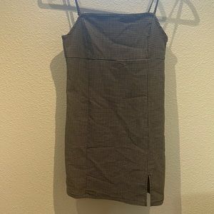 Plaid mini dress usually worn with black or white shirt under